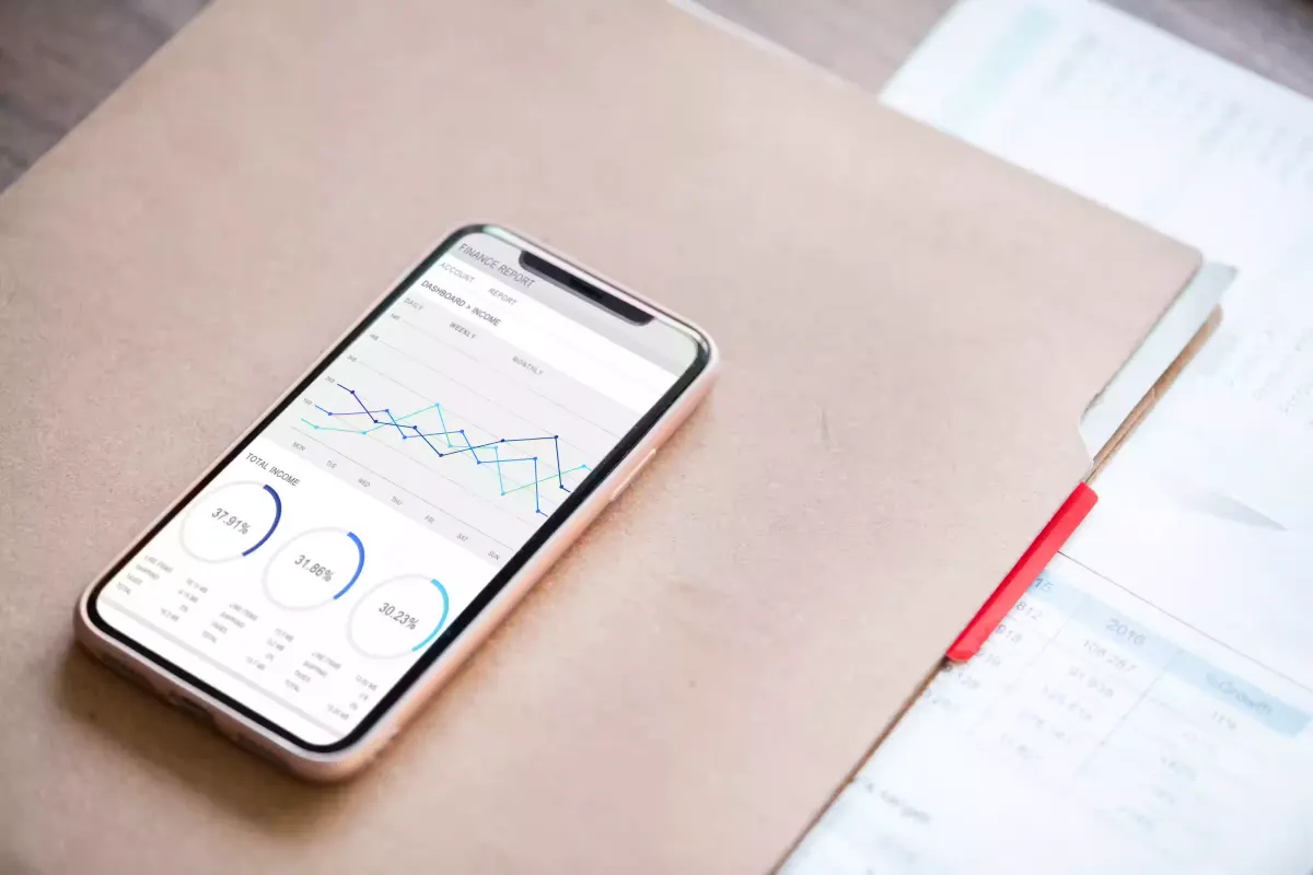 A phone showing a calm minimal business dashboard